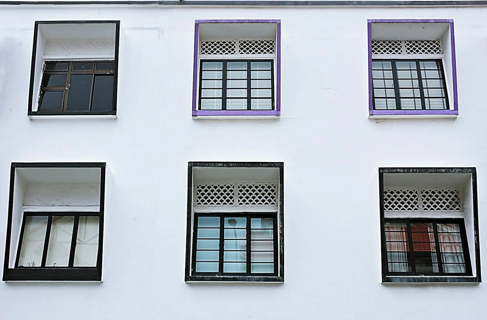 white wooden window frame on white concrete wall white wooden window frame on white concrete wall